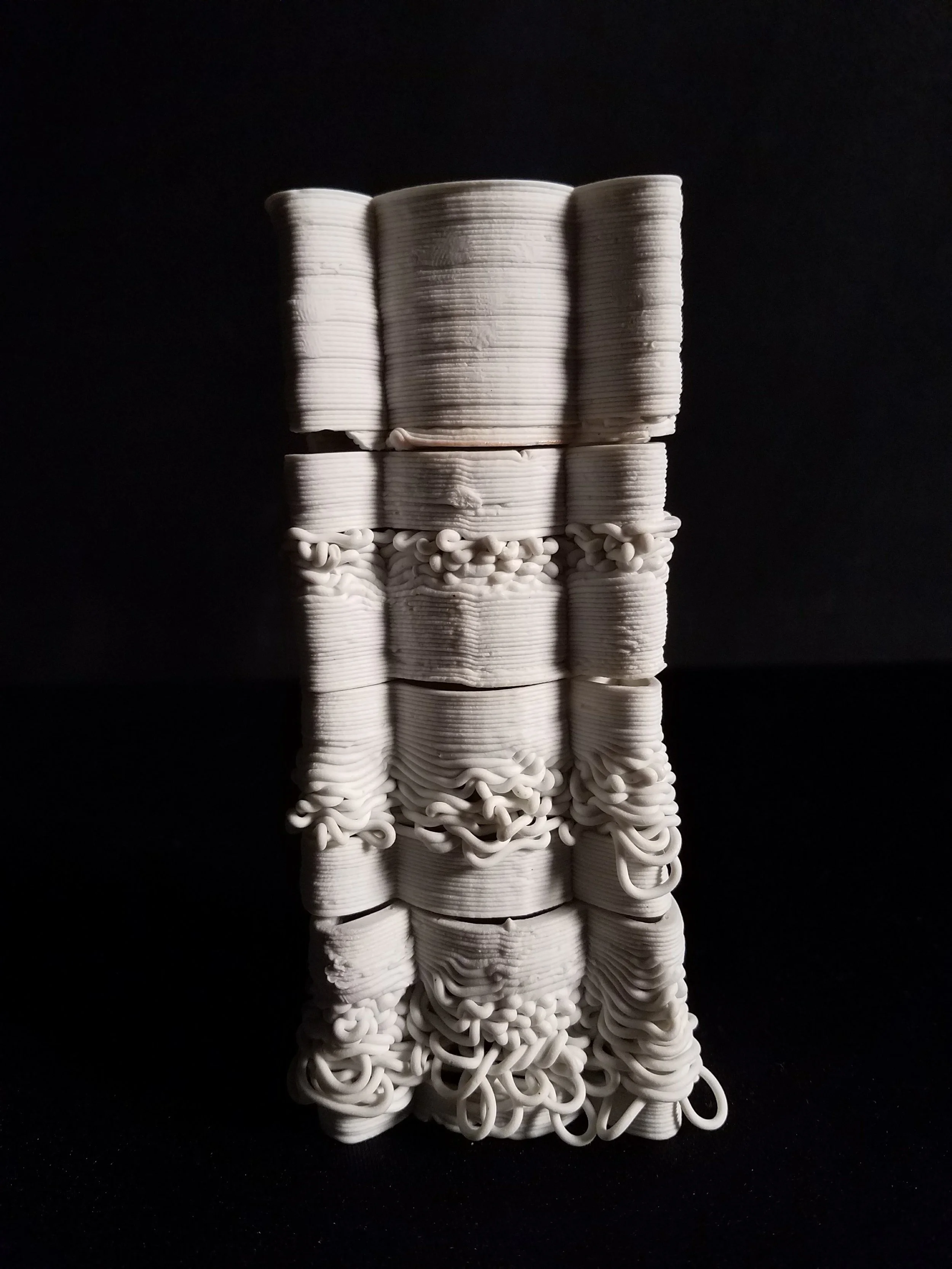  One parameter tested was an intentional z-axis height change in which the print nozzle raises at a defined point of the path and prints from a higher height allowing the clay to loop and build allowing a varied shell density 