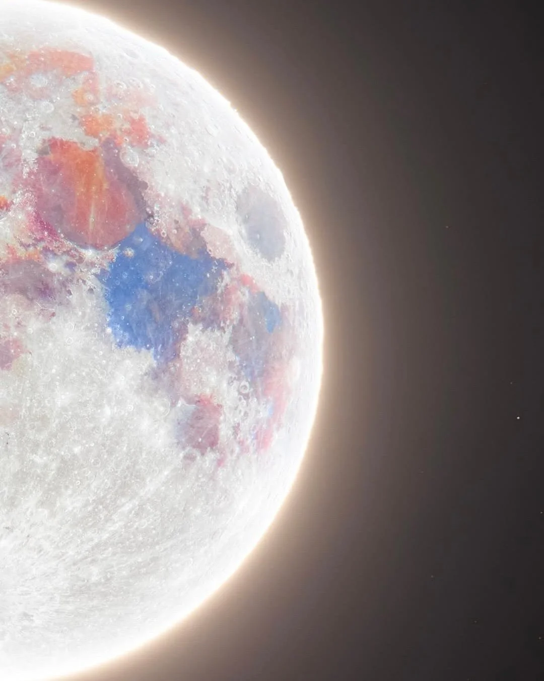 Close-up photograph of the moon showing colorful surface features with dark space background.