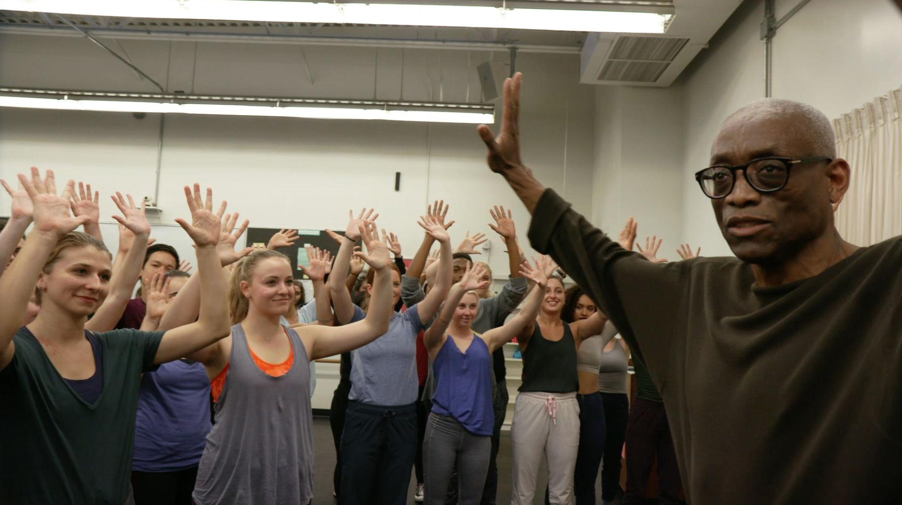 Bill and students with hands in air.jpg