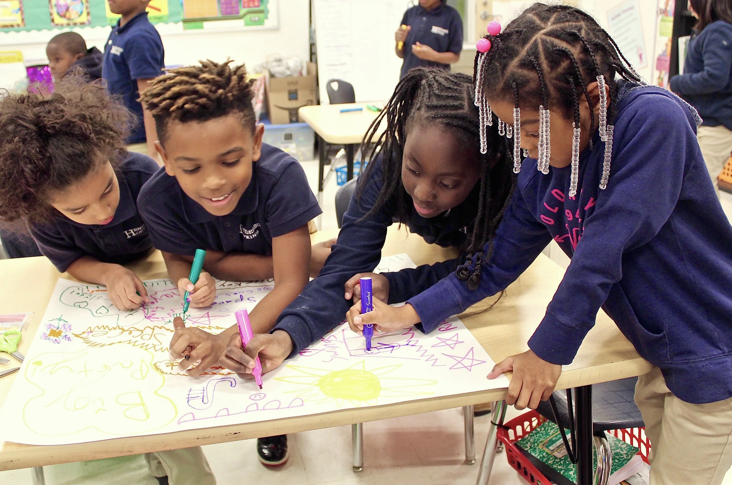 Students from the CTY Baltimore Emerging Scholars Program at Henderson Hopkins Elementary School brainstorm ideas for a new playground.
