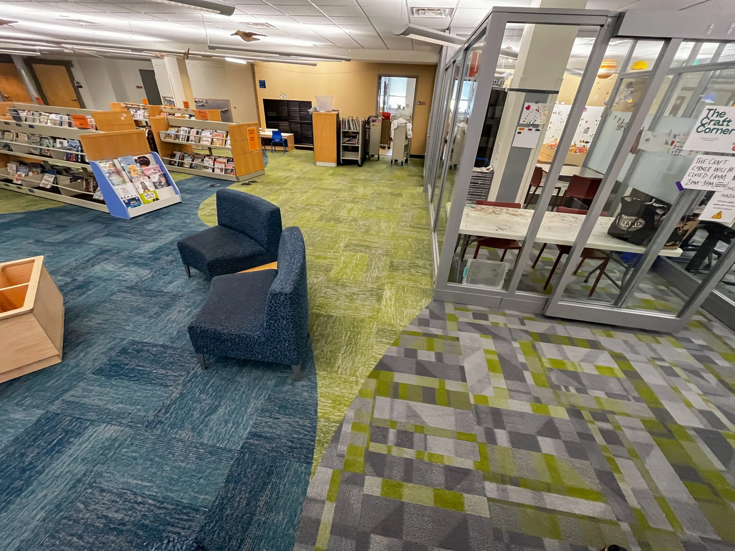 Modern Michigan library interior featuring colorful custom carpet tile flooring installed by Seelye Group LTD