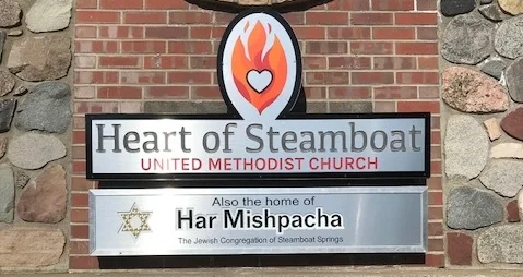 Our relationship with the United Methodist Church of Steamboat Springs is a unique one. When we were struggling to find a home for our congregation, they warmly opened their hearts and doors to our mountain family. Now, we share space for our services, events and holidays in their Spiritual Fellowship Center as well as classrooms for our Religious School. They even gave us space for our sign out front along with theirs, so that members and visitors alike can find us. We feel a special bond with the Heart of Steamboat community and hope that one day, we'll be able to invite them into a home of our own...