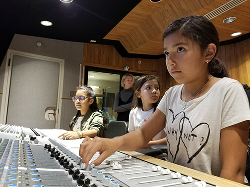 Girls on the Mic Students at the Board_credit Womens Audio Mission.jpg