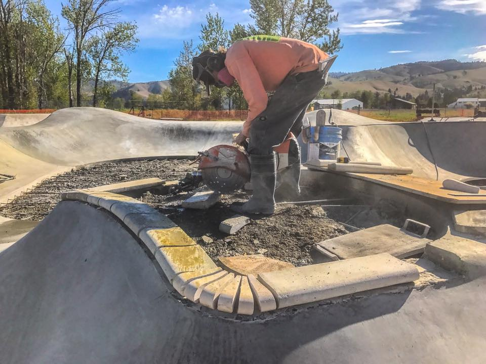 Lance Spiker puts together the pool coping island