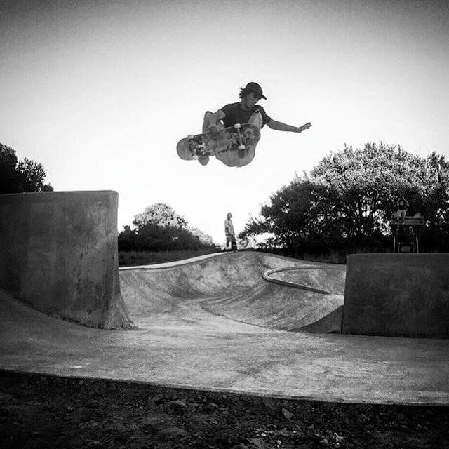 Crew member airs over the channel at the Hernando, Mississippi Skatepark