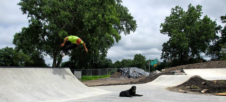 Billy skates the Buffalo, New York Skate Plaza while Jake lounges on the concrete