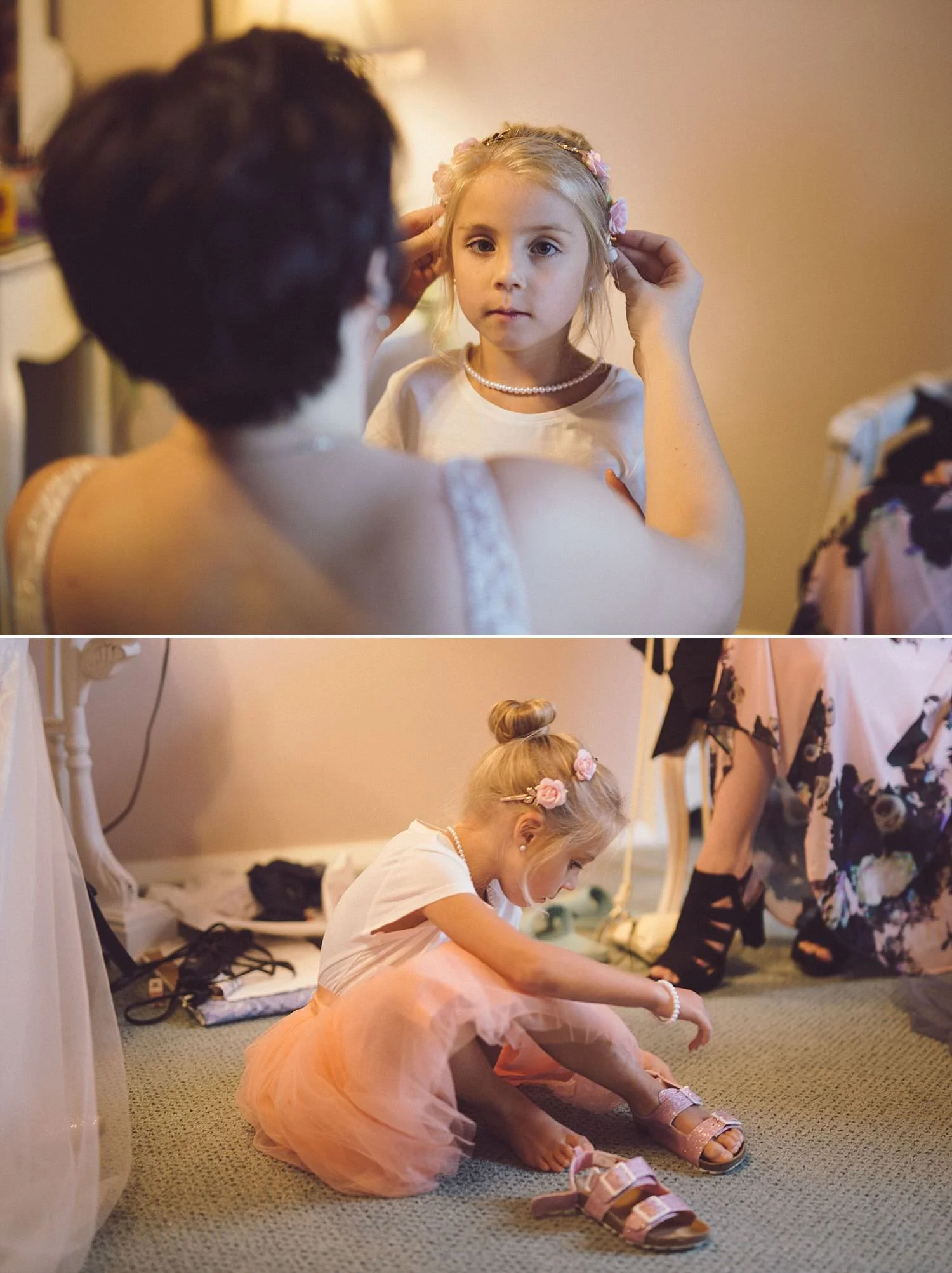 Bride fixing flowergirl’s hair, putting little shoes on