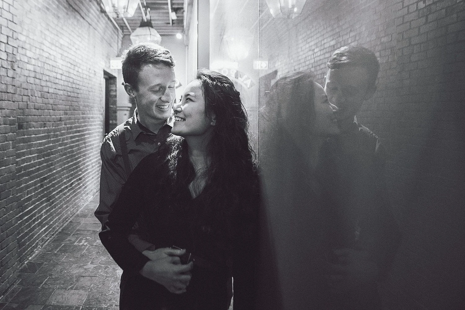 Tim holds Angel as she smiles at him