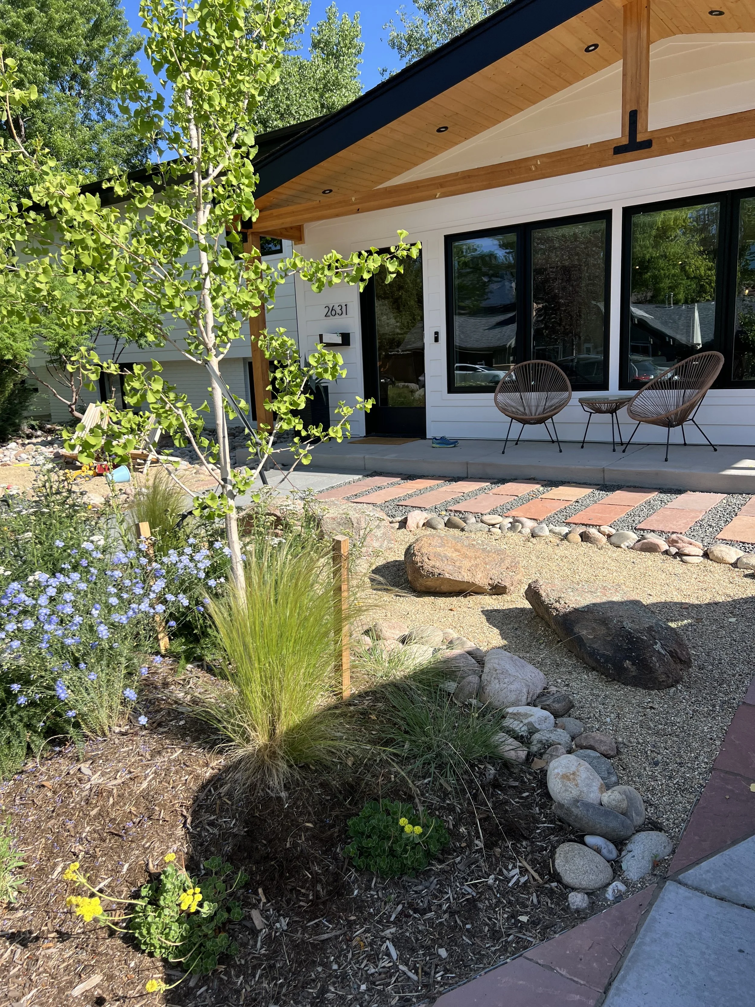 xeriscape with nature play and flagstone pathways 