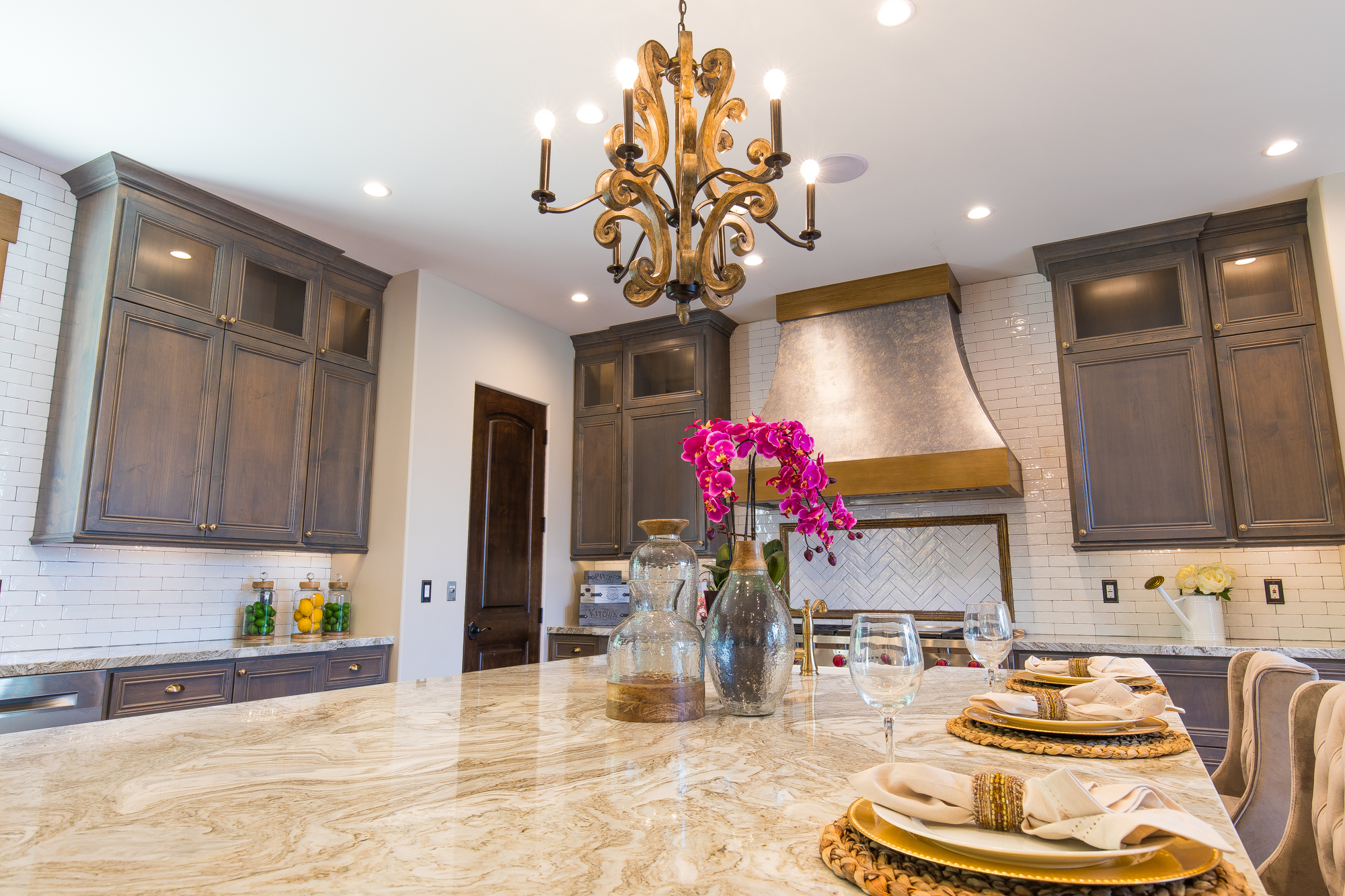  Pristine European White Oak hardwood floors, recessed lighting, in-ceiling speakers and a richly textured six light candle style renaissance patina chandelier finish the kitchen beautifully 