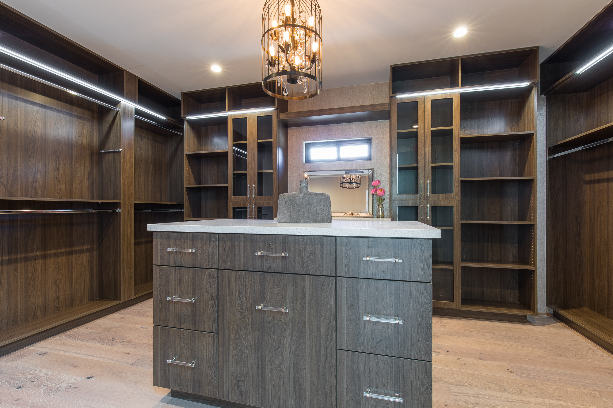  This exquisite suite includes a stunning walk-in closet with custom made glass front cabinetry featuring custom shoe and clothing built ins, pull out valet rods, pull out scarf/tie/belt racks, recessed lighting, vintage bird cage crystal chandelier,