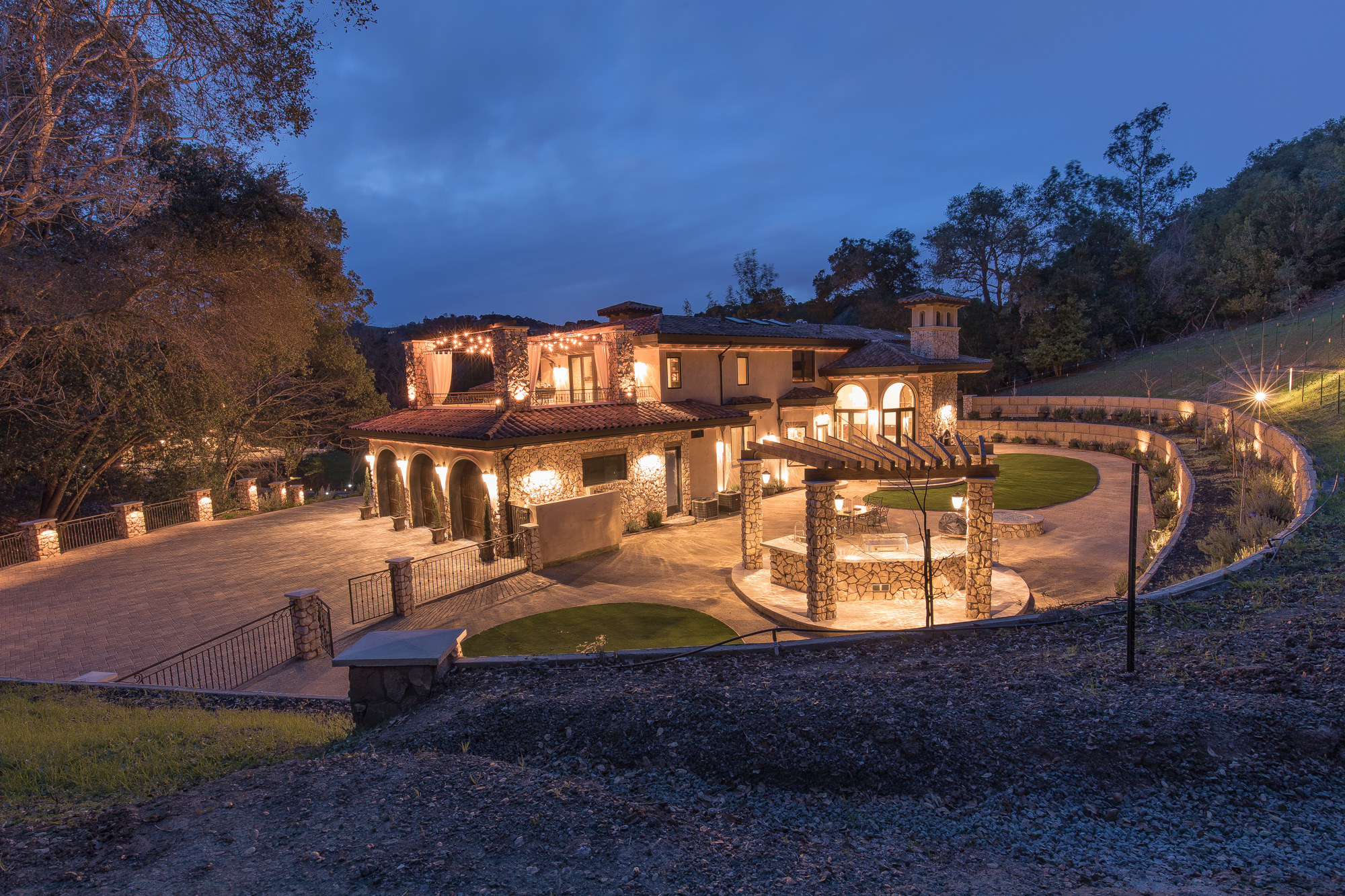  Extensive outdoor lighting illuminates the space and provides the perfect ambiance for entertainment or relaxation 