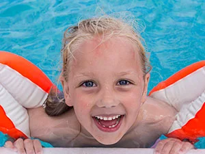 Young Girl Learning to Swim