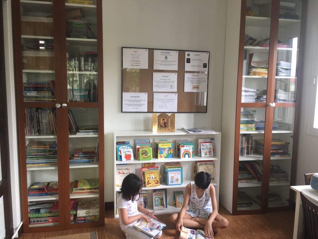Siblings Aniya (6)and Ilai (8), reading their good books.