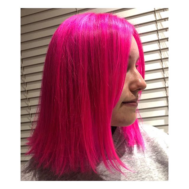Pink hair, no cares! This vibrant neon colour is a head turner.