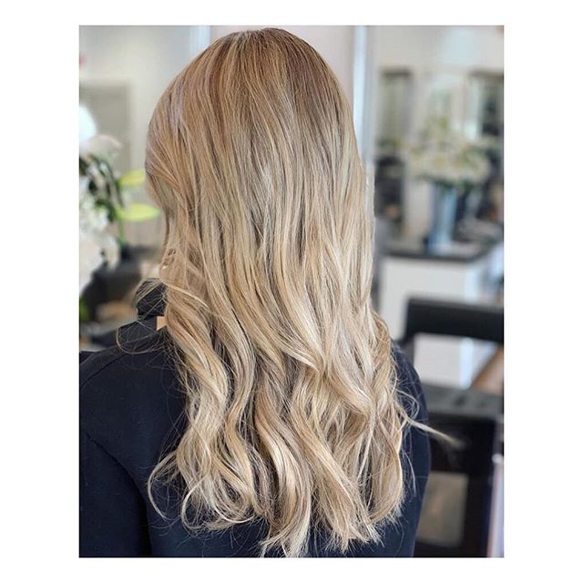 Going blonde shouldn't sacrifice the condition of your hair. This colour took two sessions by @hair_by_karen_jones to achieve the desired level of vanilla blonde while the happy customer was able to walk out of the salon with healthy hair each time.