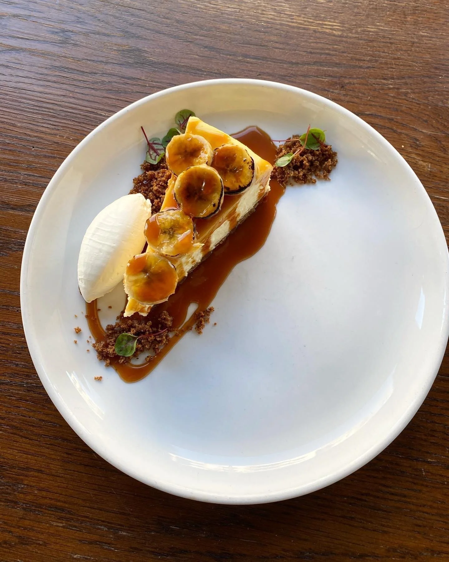  banana’s foster cheesecake • rum caramel • brown butter crumb with @anonymousajg | @okuatlanta  