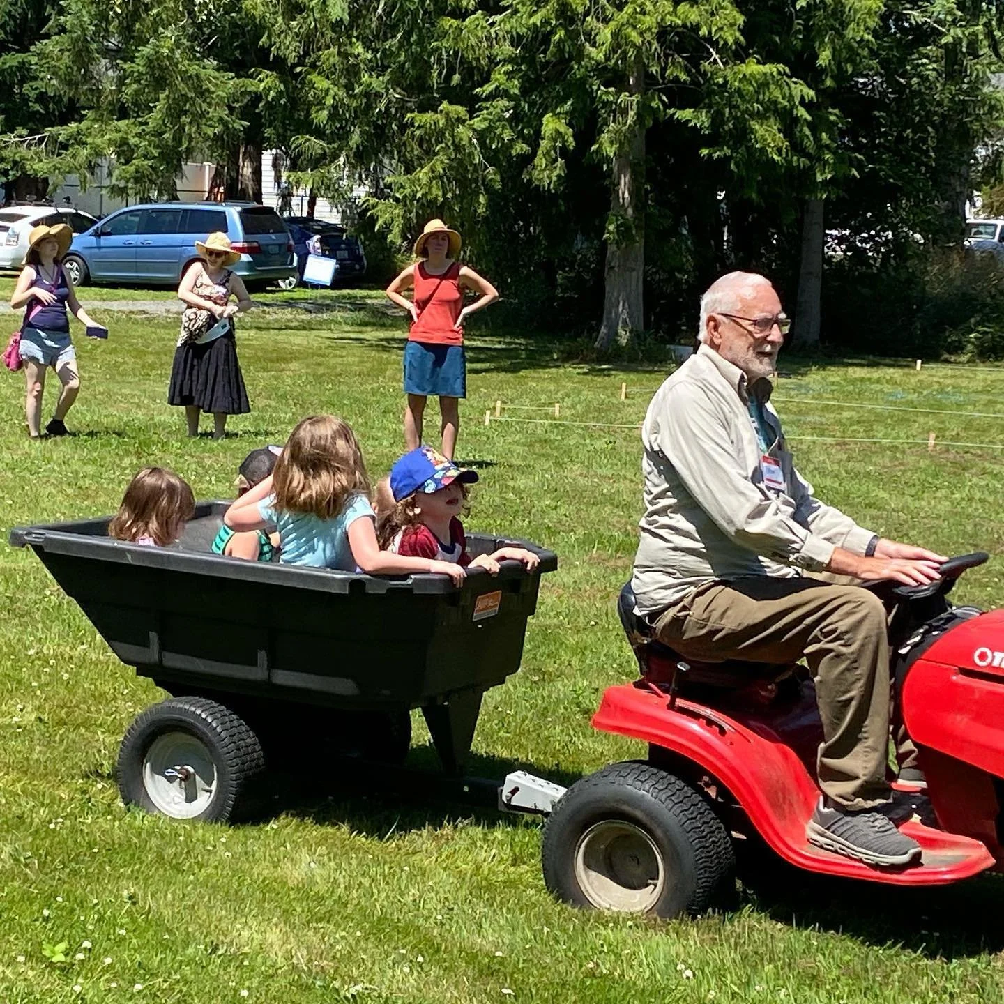 dean driving children on tractor.jpg