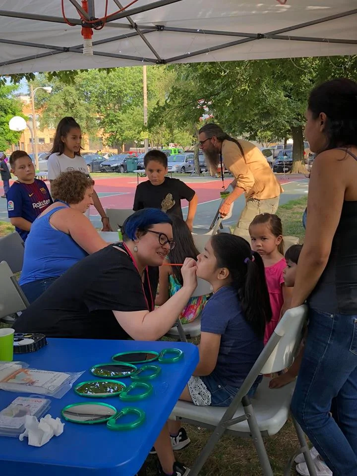 Painting faces at the "Night Out in the Parks" screening of Black Panther.