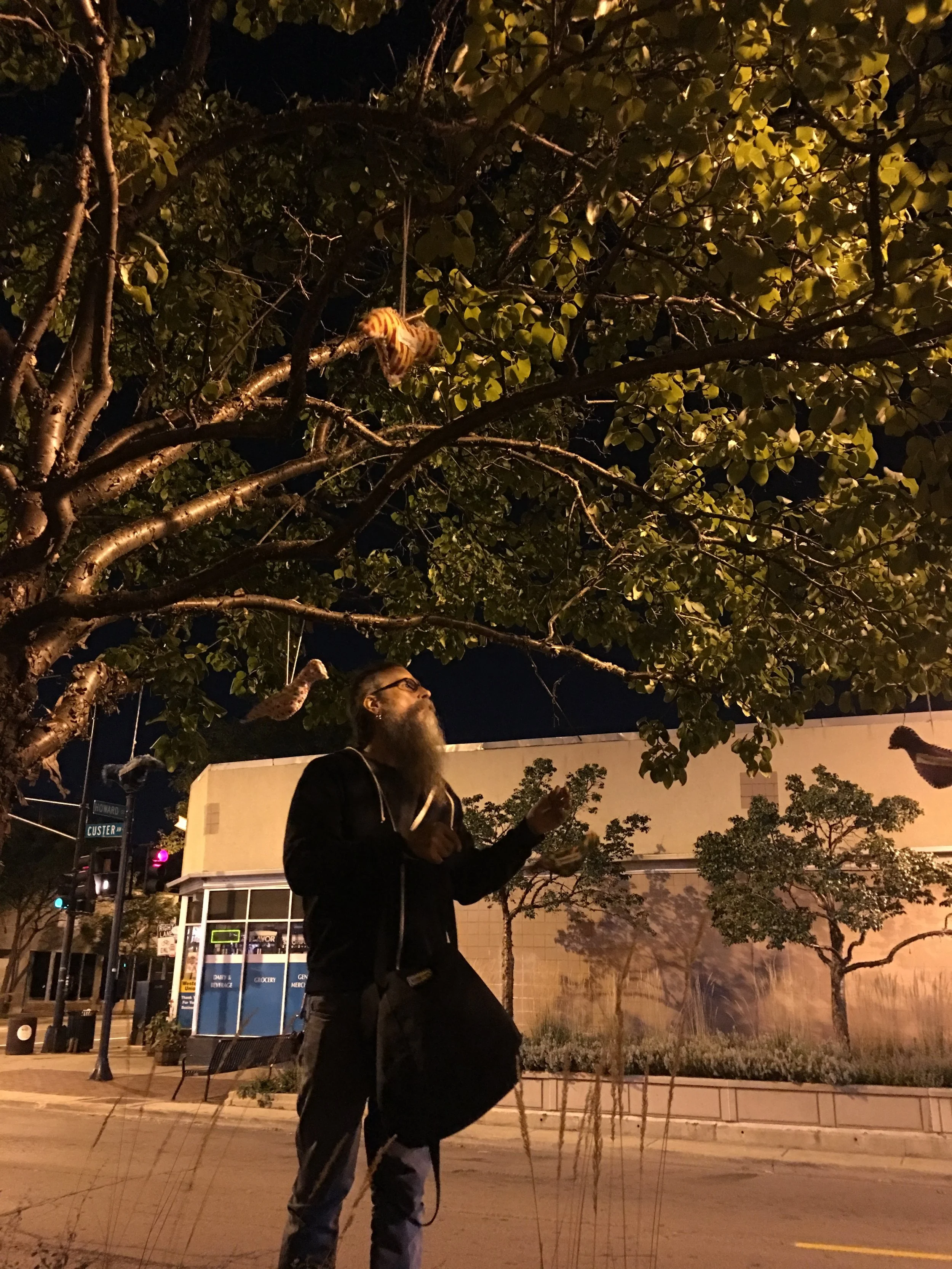 John-Michael hangs birds at the site of a recent shooting.