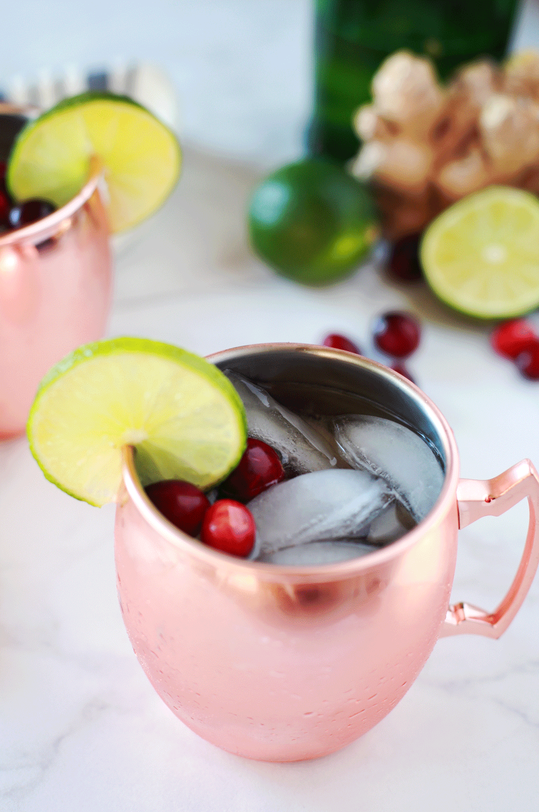 Recipe and image: https://tangledwithtaste.com/cranberry-lime-moscow-mule-mocktail/