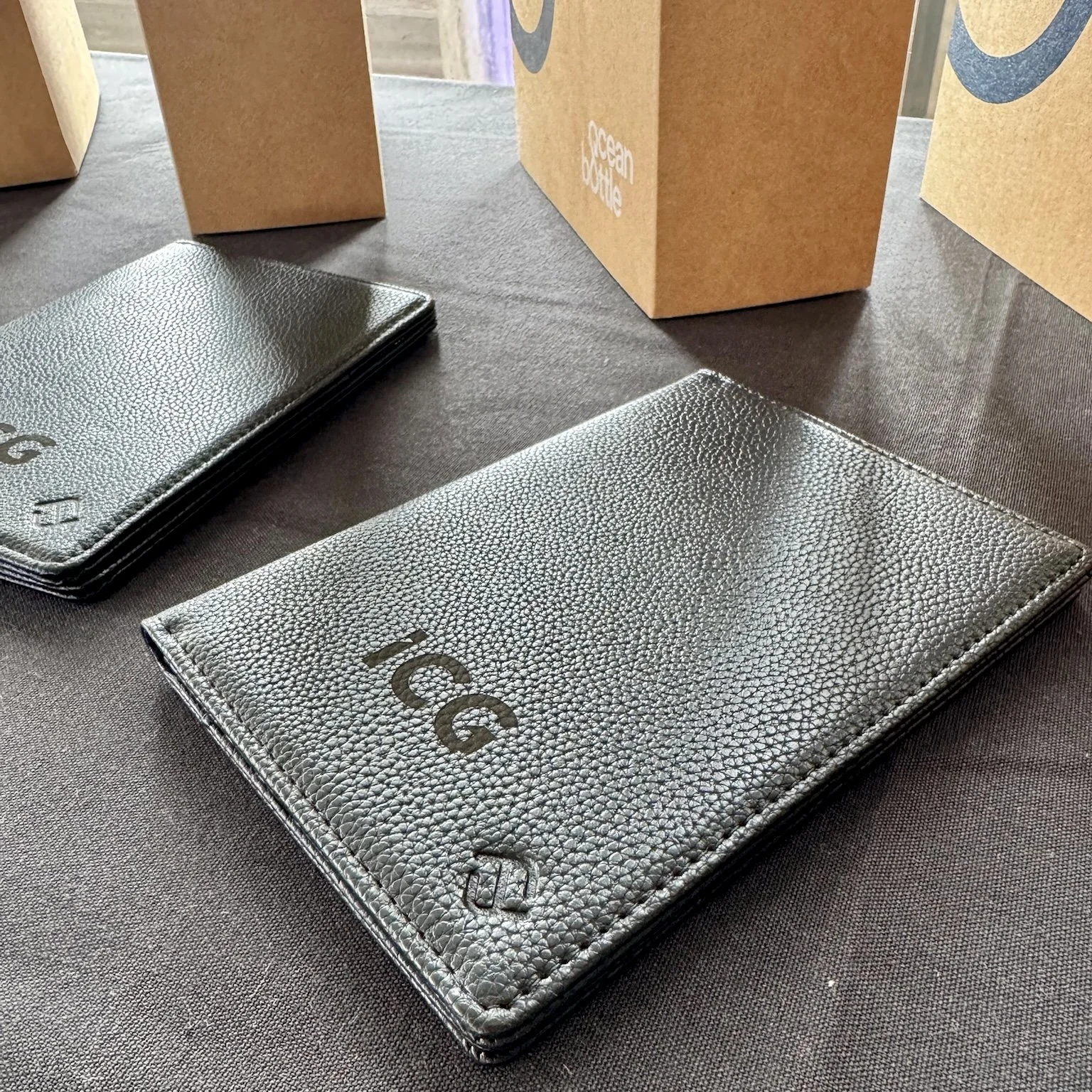 Close-up of an ICG-branded passport holder personalised for a guest