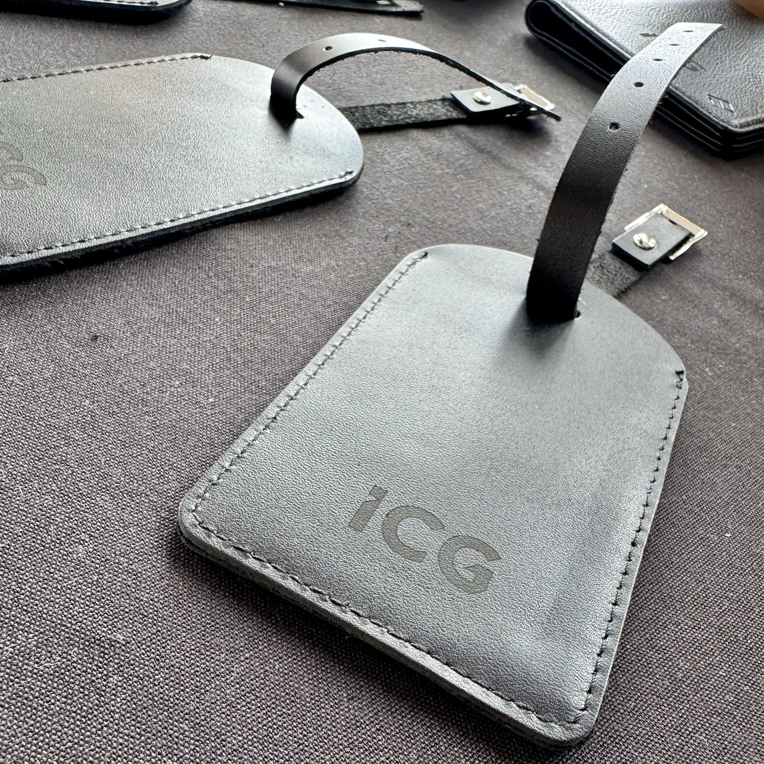 Personalised ICG luggage tag displayed on a table