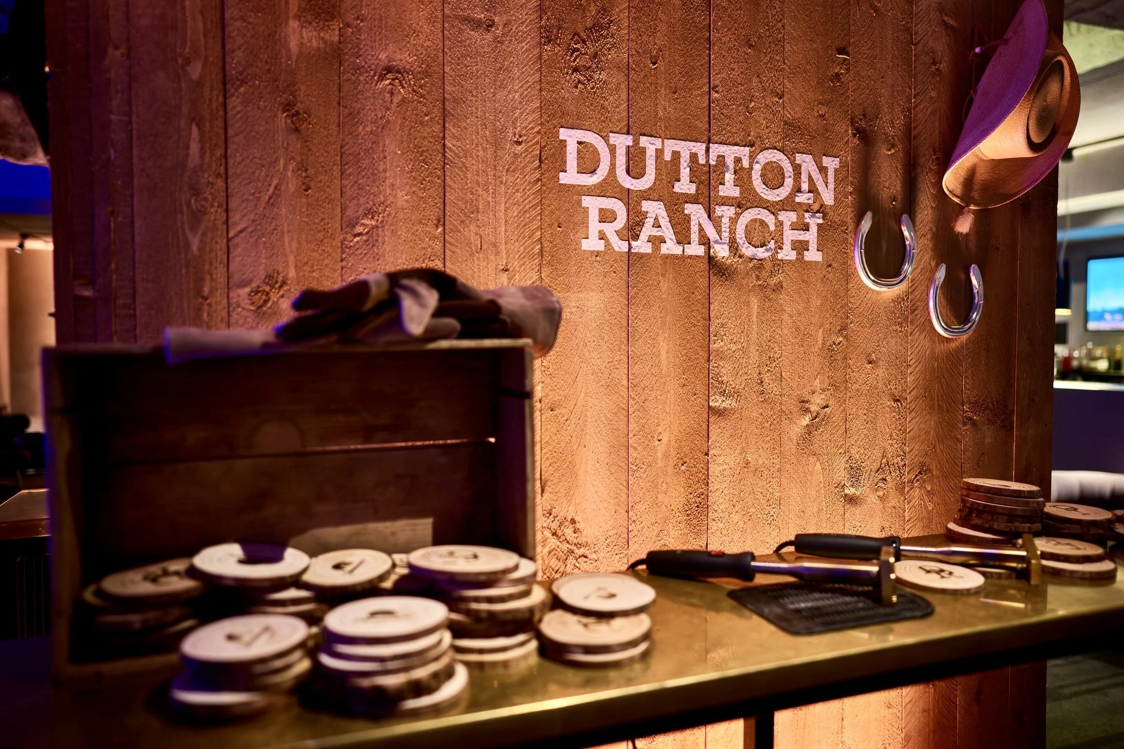 Rustic Dutton Ranch event display with wooden decor and table setup