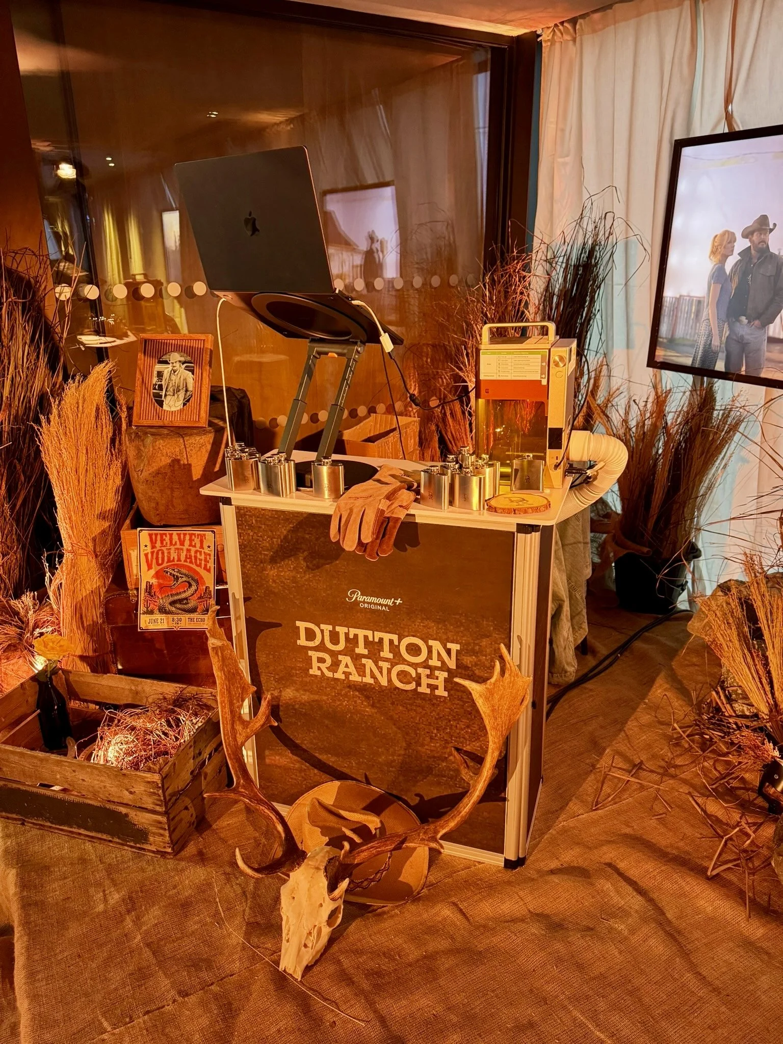 Western-themed event installation with rustic props and branded decor
