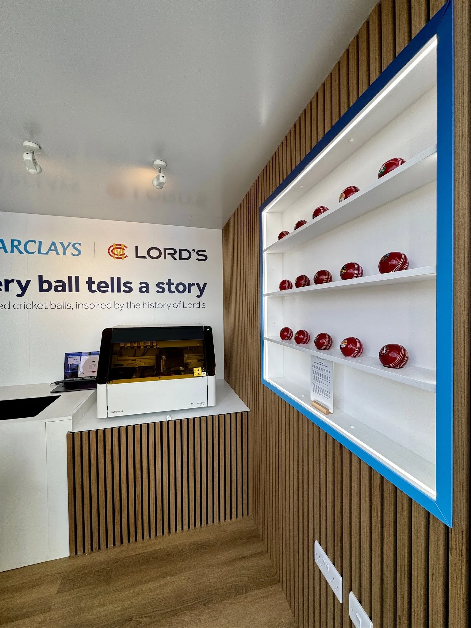 Indoor display area showcasing cricket ball designs for the Barclays activation