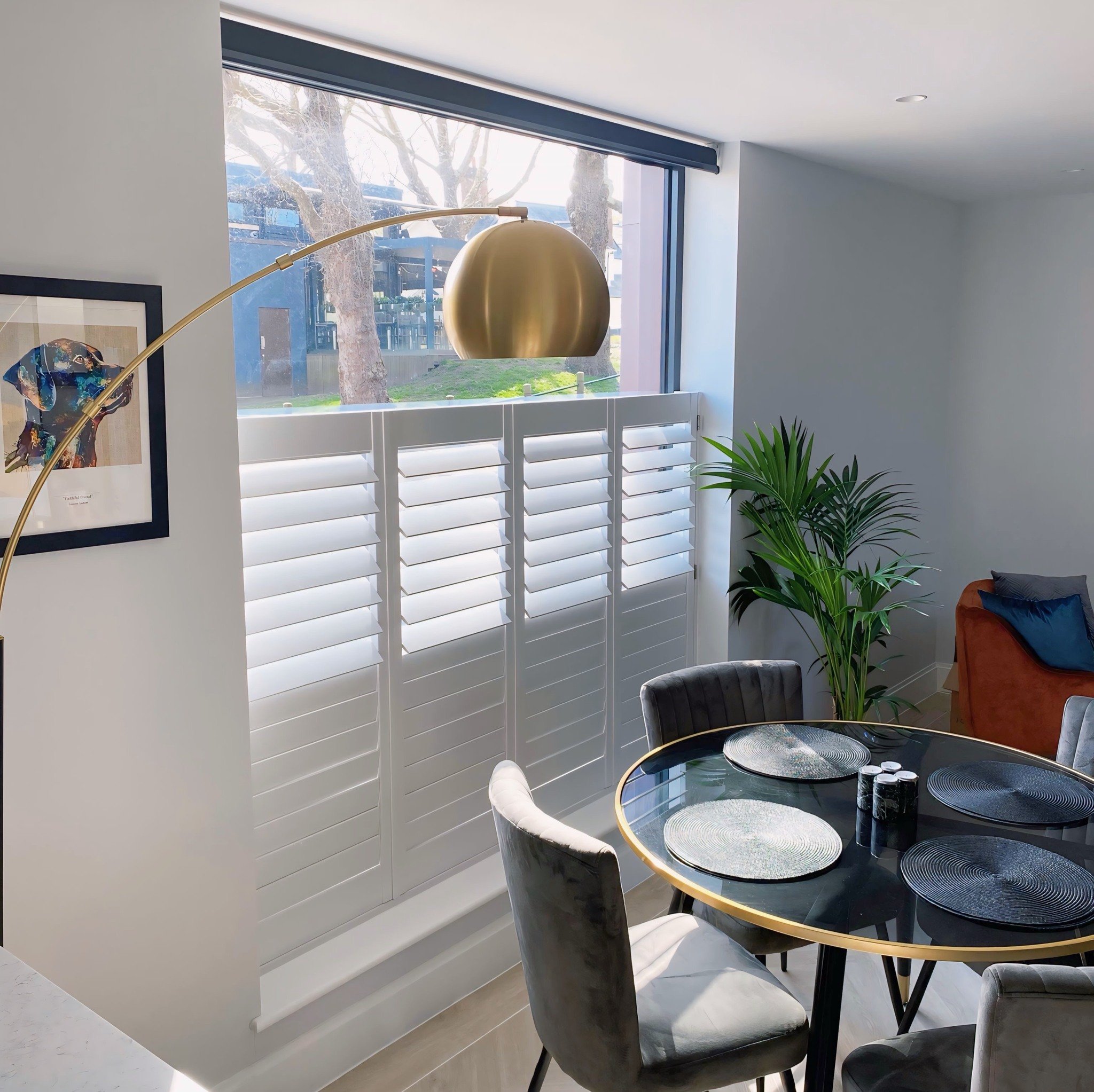 Our Customer's Vision Truly Came to Life With Our Solid Wood Cafe Style Shutters and Expertly Paired Roller Blinds. Crafted in Custom Colour Farrow and Ball Blackened with Stainless Hinges, our Cafe Style Shutters Exude Timeless Elegance. 

Paired Wi
