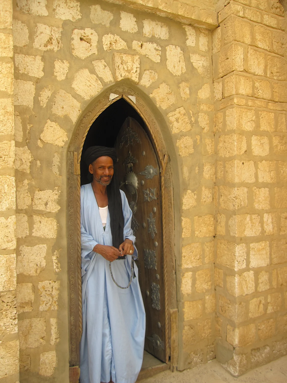 A man poses at the Sankoré university. Photo: Patti Neves