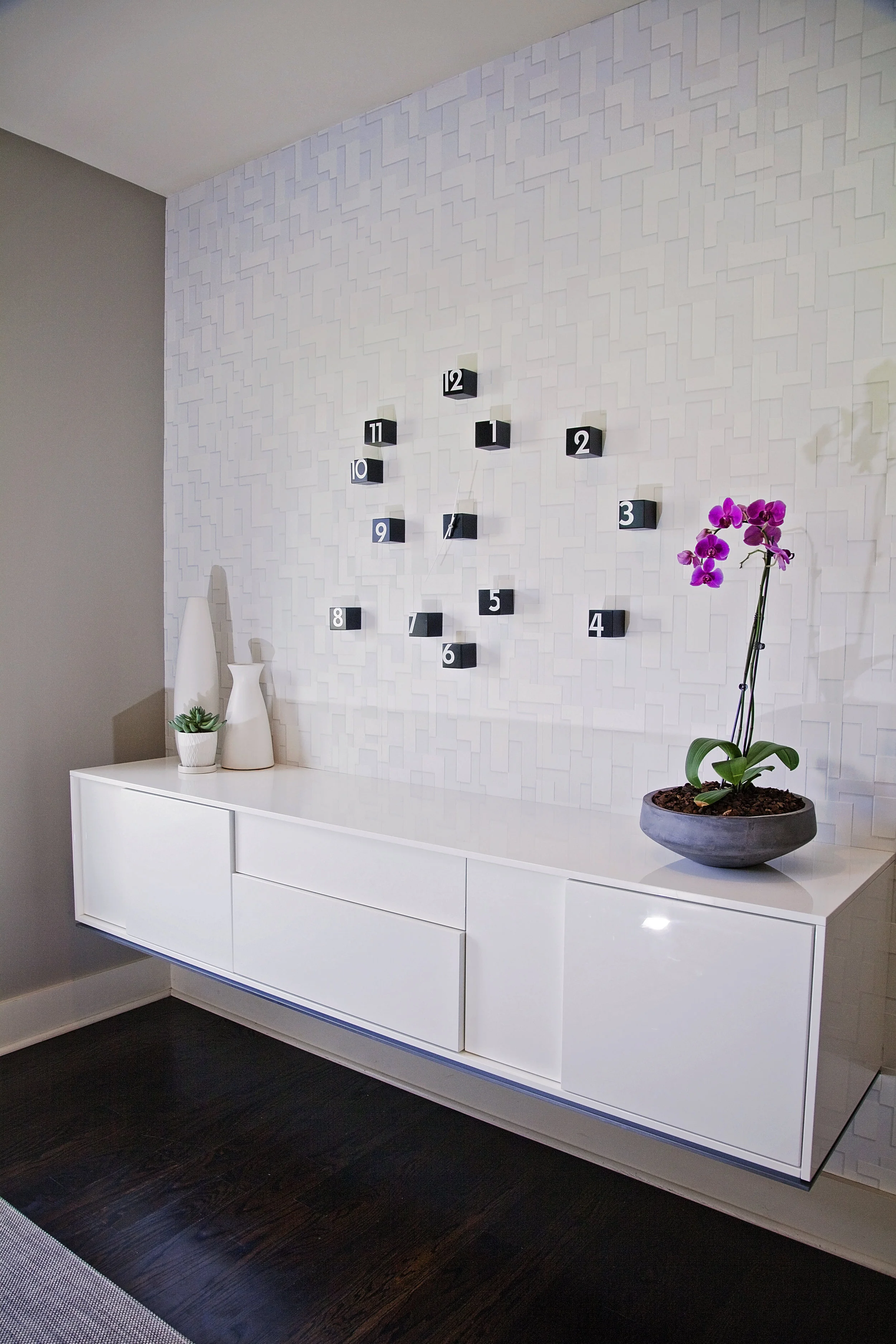 The left wall in the home’s front entry is now a show stopper.