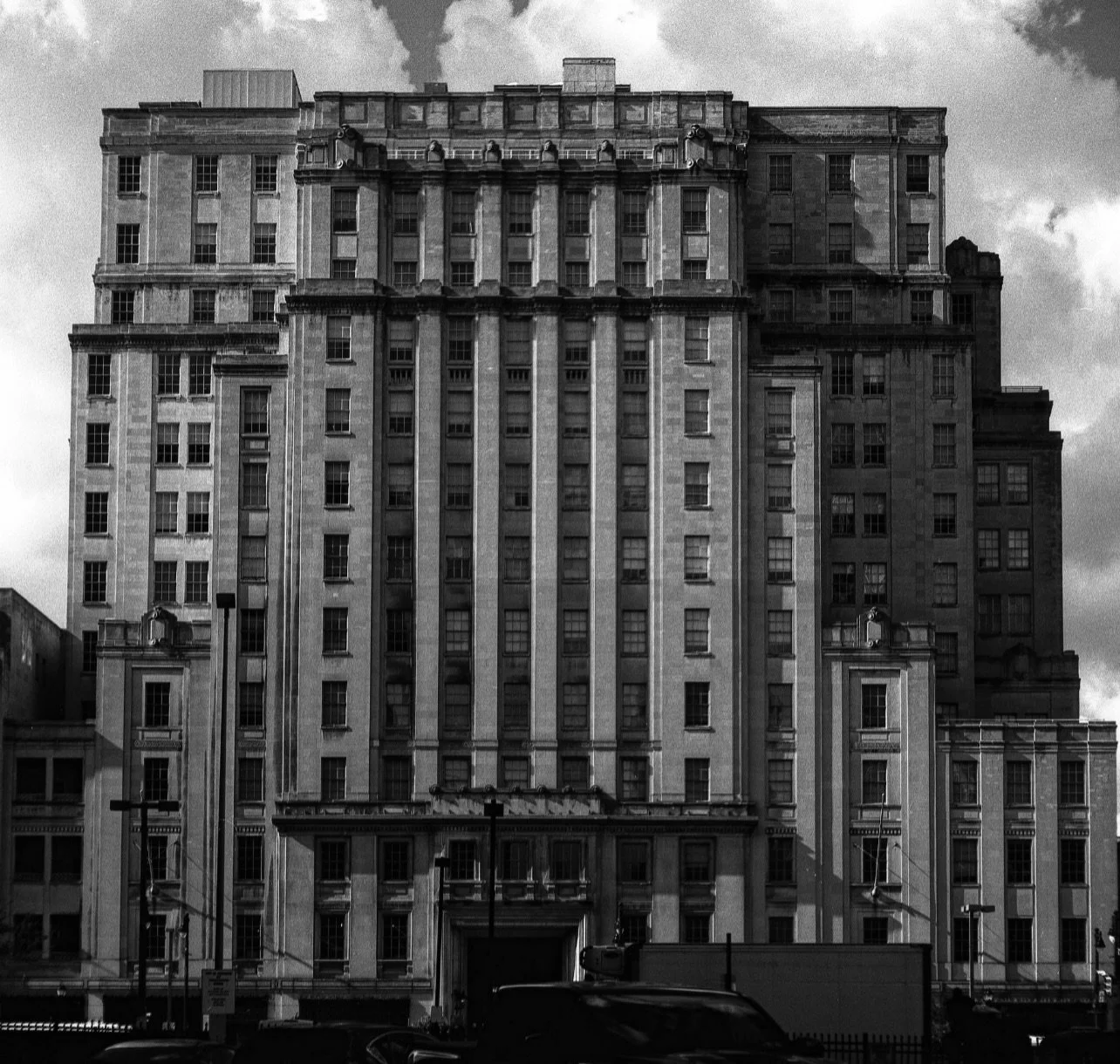 Some scenes stick with you. When I first saw this imposing Art Deco limestone block, I only had color film on me. Given the quality of the light and the perspective, my gut told me that monochrome and a contrast filter would do a better job capturing
