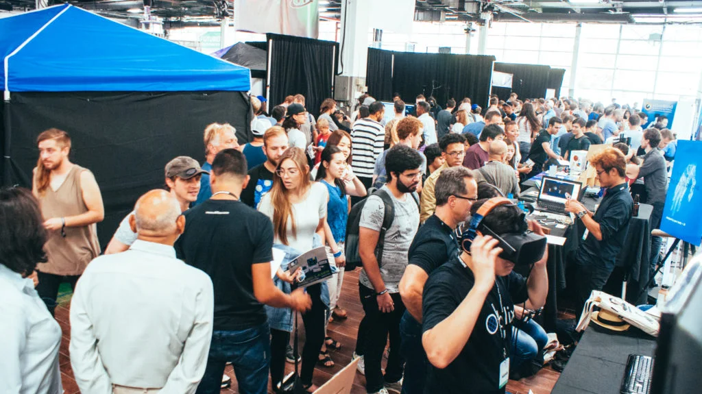 A large crowd of World Fair Nano attendees behind Oblix’s booth.
