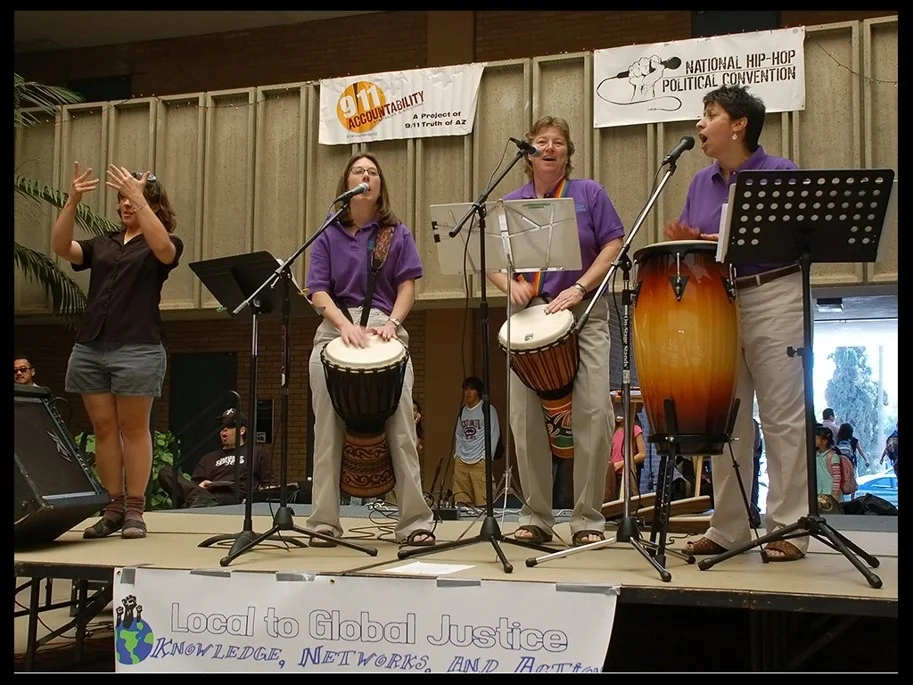 Us Gaias Percussion Ensemble and Haley Ritter, ASL Interpreter, at Global Justice Teach-In.