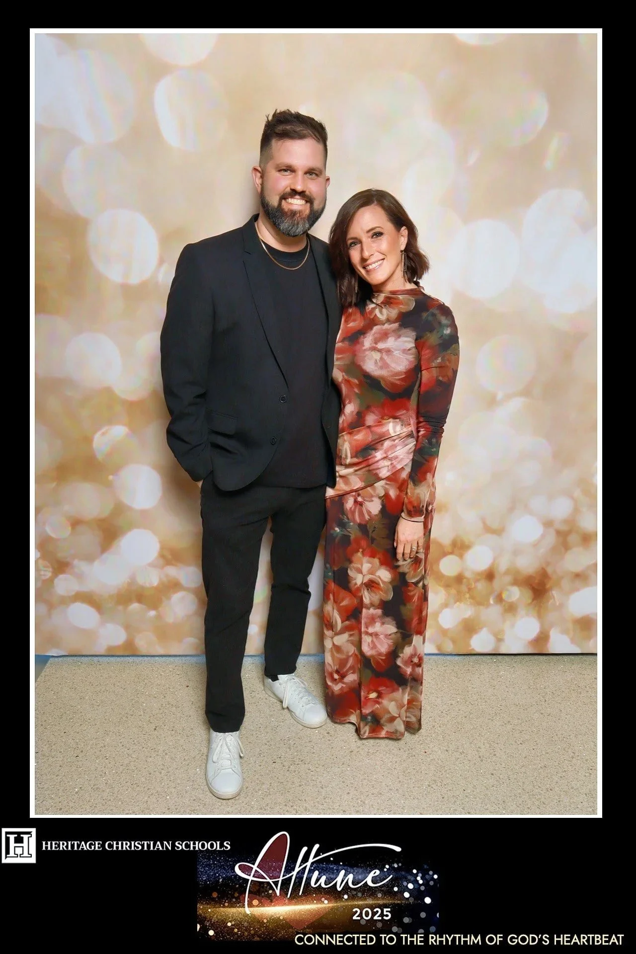 Formal couple posing at Heritage Christian Schools "Attune" gala photo booth in Brookfield, WI