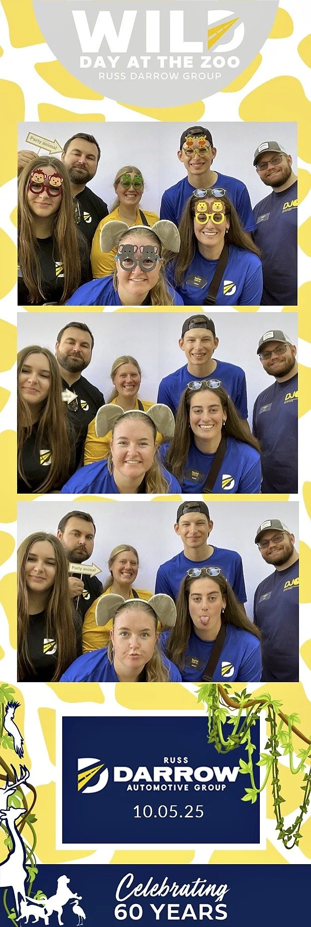Family posing with props at Russ Darrow Automotive corporate photo booth event at the Milwaukee Zoo