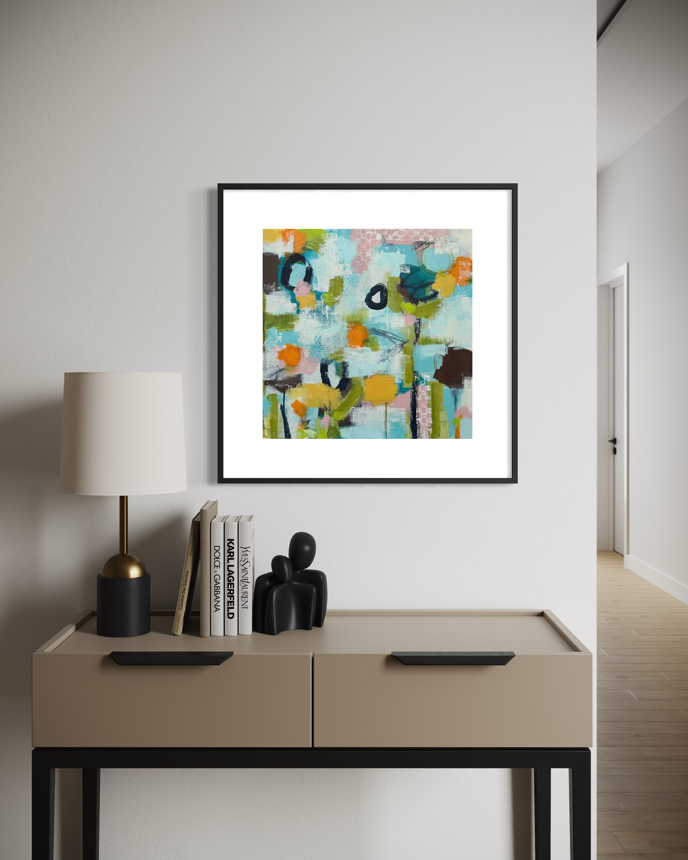 Bright abstract floral landscape painting in blue and green, shown framed in a home setting