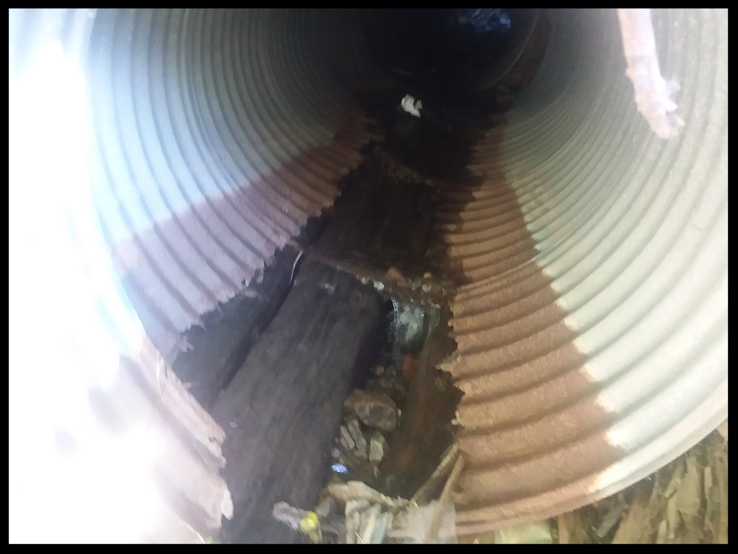 sluice pipe under trail.jpg