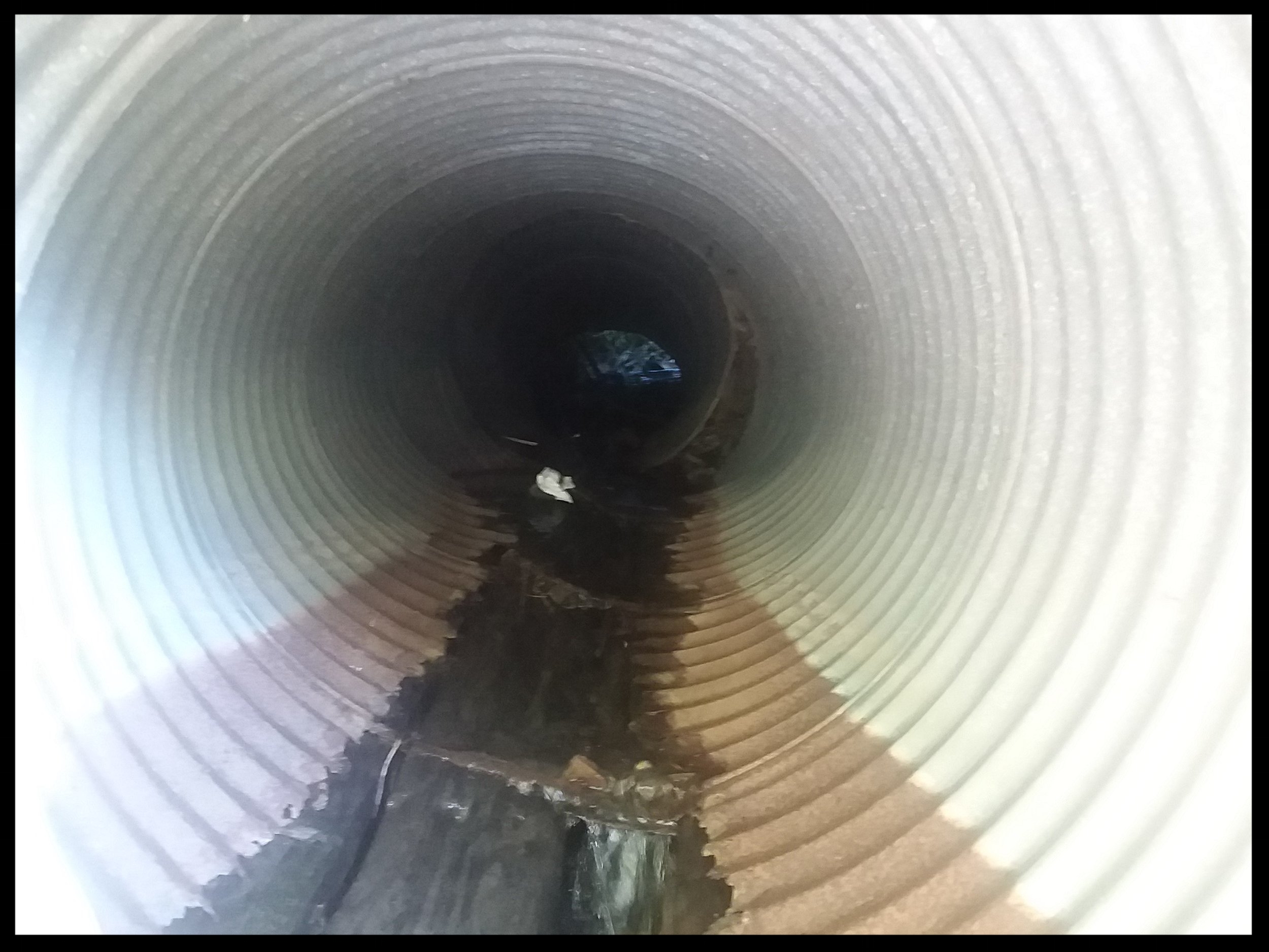 sluice pipe under trail2.jpg