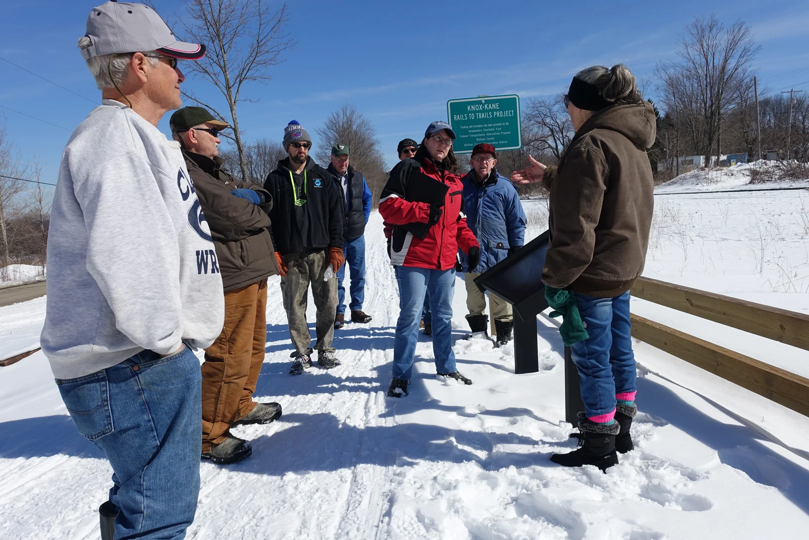 Brenda (in red coat) talking about interpretive signs.