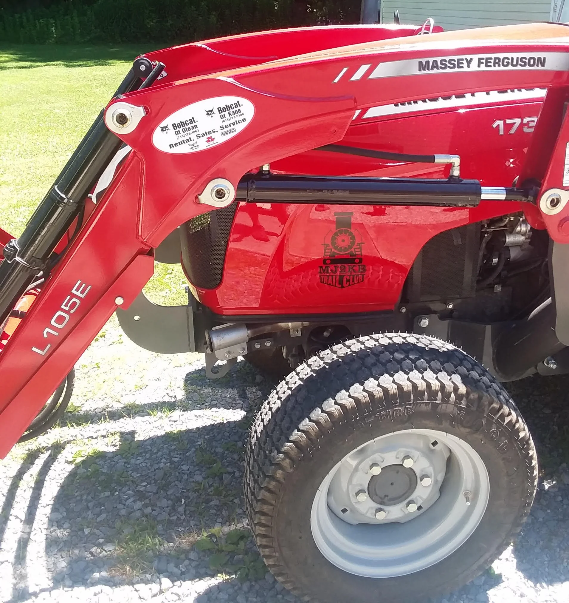 Logo (decal) on our new tractor. Picture to the right: shipping Container for storage now on trail in Mt Jewett. We need to paint it - maybe a nature scene?