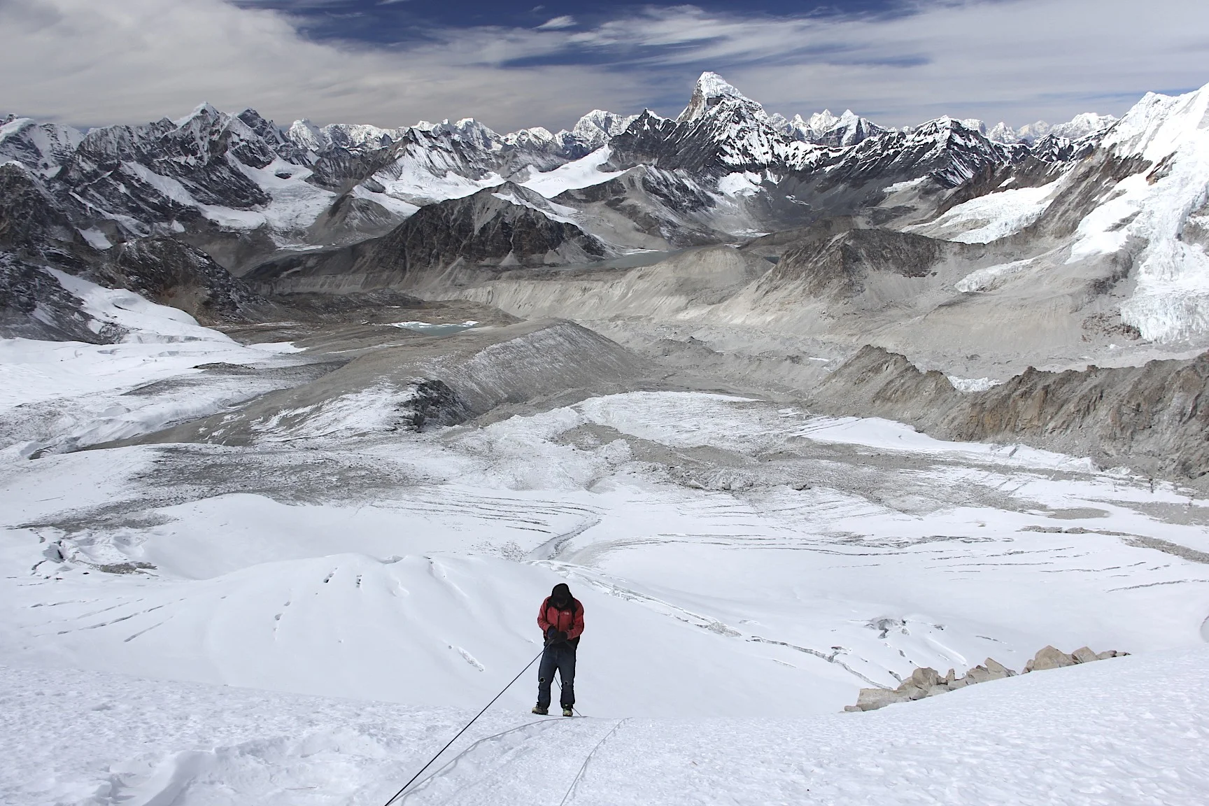 Looking down from the West Col Pass at 6,150m. Descending from the West Col with a spectacular panorama of high Himalaya. You can even see Shishapagma on the extreme right in the far distance.