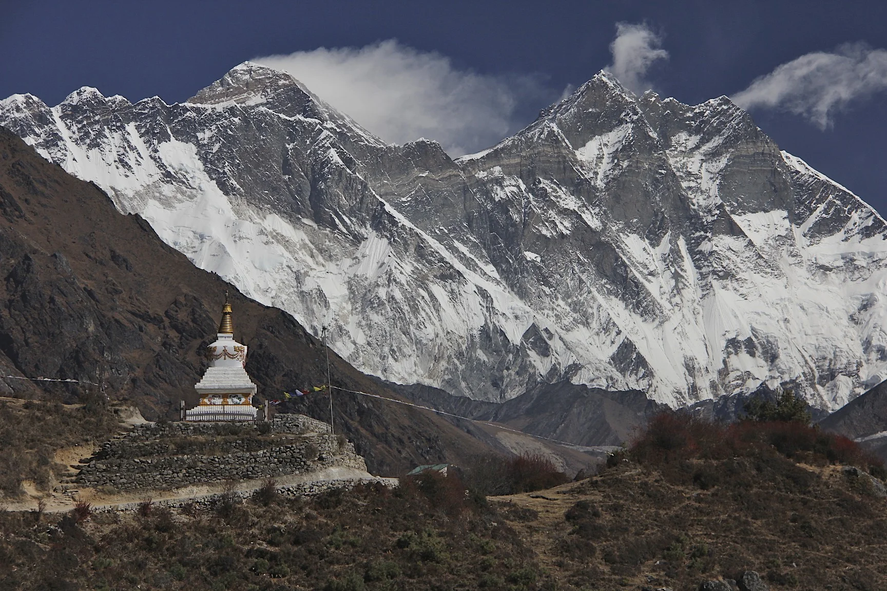 Nuptse, Mount Everest (behind the ridge) and Lhotse (on the right). Notice the strong wind blowing across Mt,. Everest’s summit.