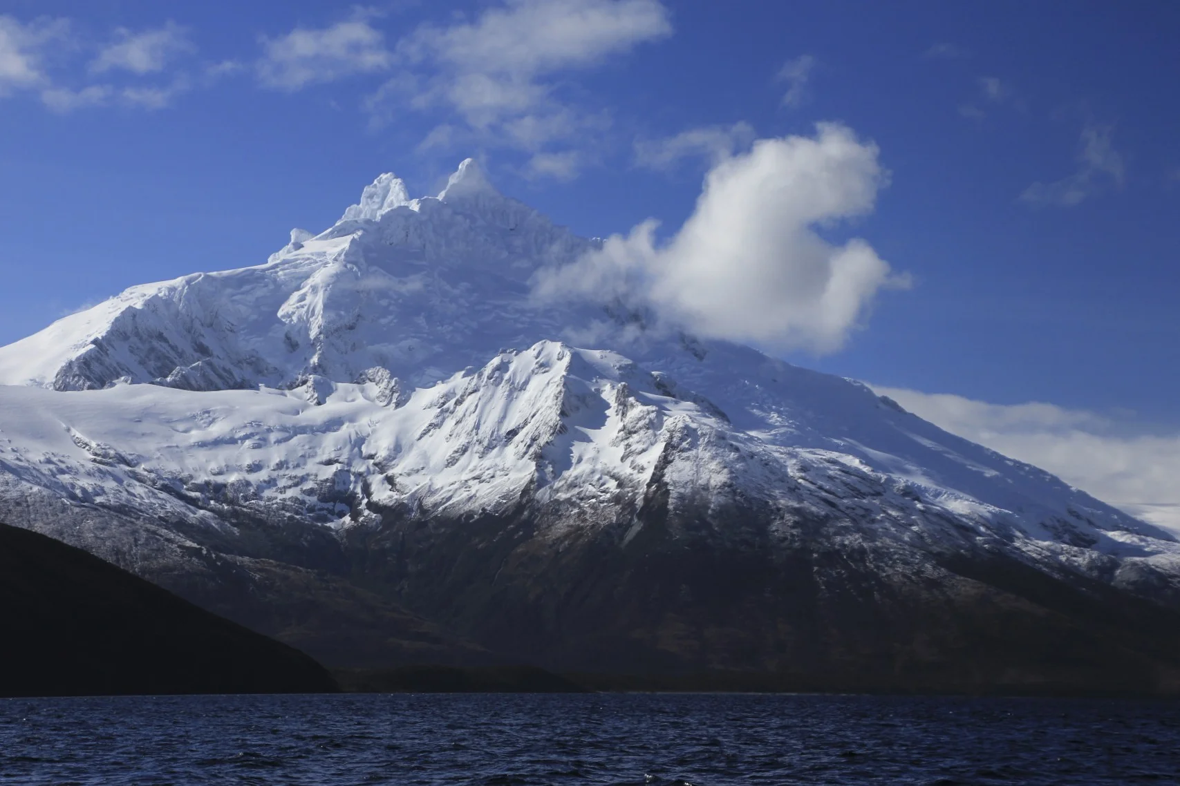 Mount Sarmiento 2,187m, the highest peak of the Tierra del Fuego. Due to very fickle weather intros part of the world, this mountain is often obscured by clouds.