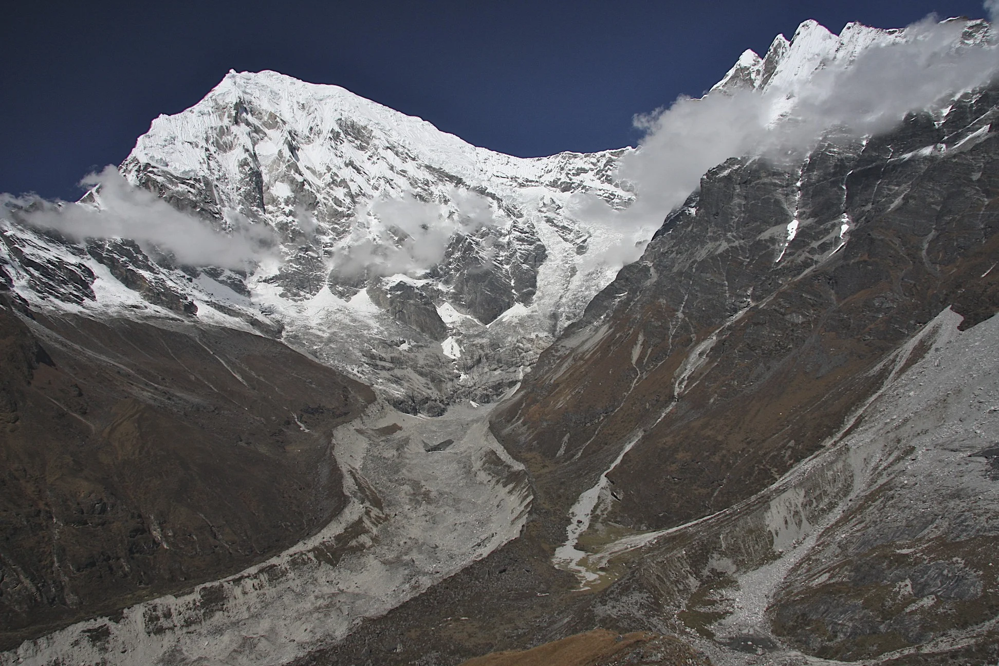 Langtang Lirung Glacier and basecamp. The tent of late Tomasz Humar is visible by the moraine in the centre. He died a few days after this photo was taken on the rocky slopes of Langtang Lirung above the BC on the ridge visible on the left side of the photo.