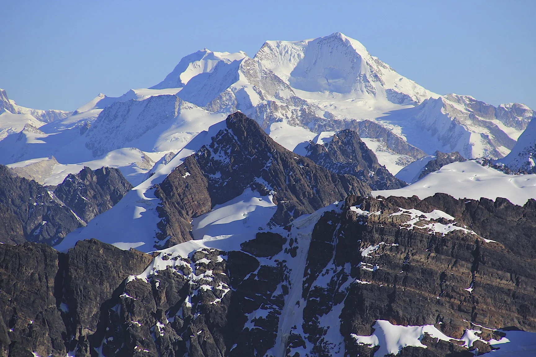 The large bulky mountain is Chachacomani 6,074m fromt the summit of Pequeno Alpamayo.