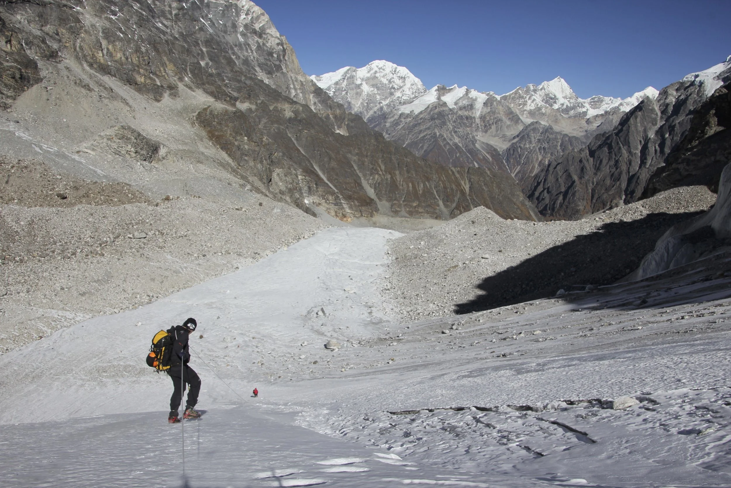 Descending the glacier using the fixed rope.