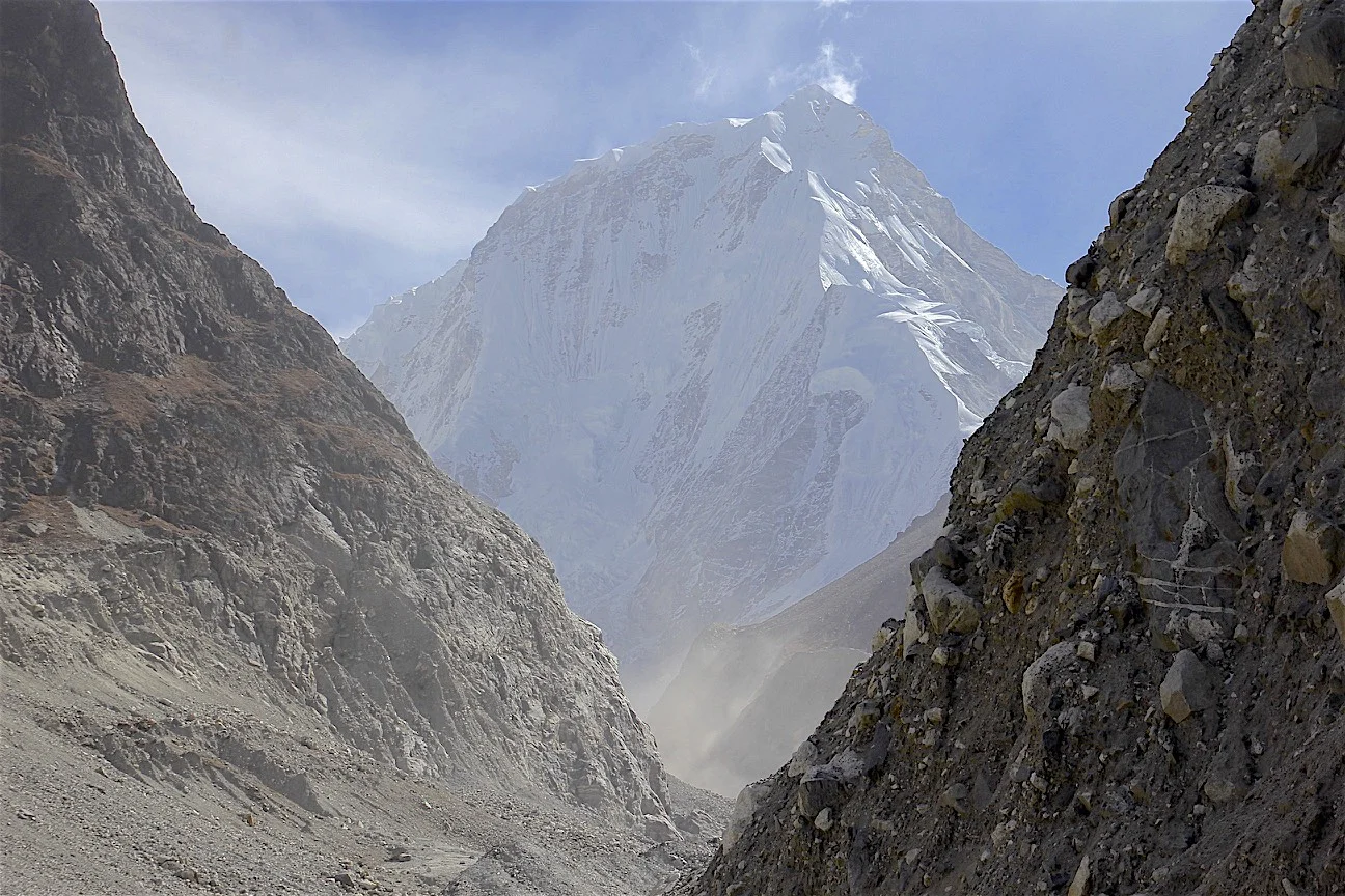 Crazy moraines! After the sun hits this slope, the bombardment starts. The rocks are held by consolidated frozen mud. Mount Dorje Lakpa 6,966m dominates the end of the valley.